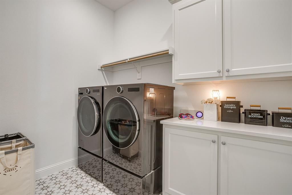413 Kestrel Court Aledo, TX 76008 - Photo 34 of 40 a utility room with dryer and washer