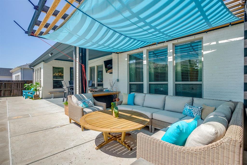 413 Kestrel Court Aledo, TX 76008 - Photo 36 of 40 a outdoor space with patio the couches and a potted plant with the view of garden