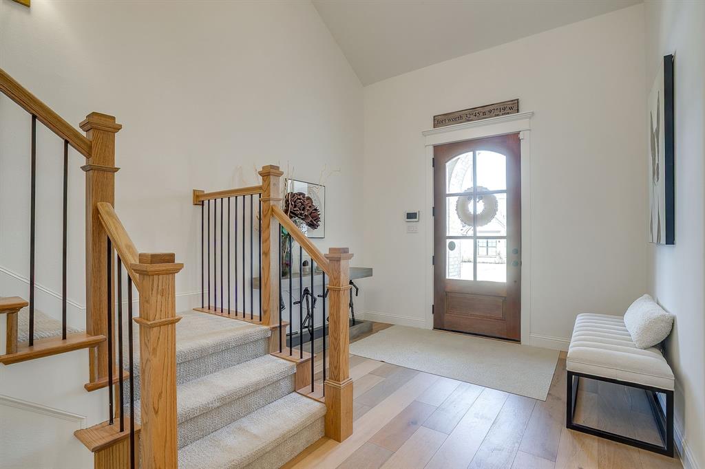 413 Kestrel Court Aledo, TX 76008 - Photo 4 of 40 a view of an empty room with wooden floor and windows