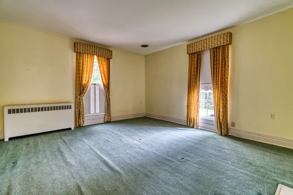 a view of an empty room and window