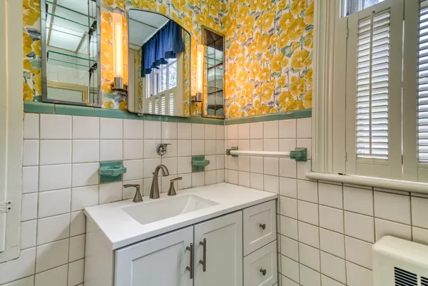 a bathroom with a sink and a mirror