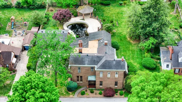 an aerial view of residential houses with outdoor space