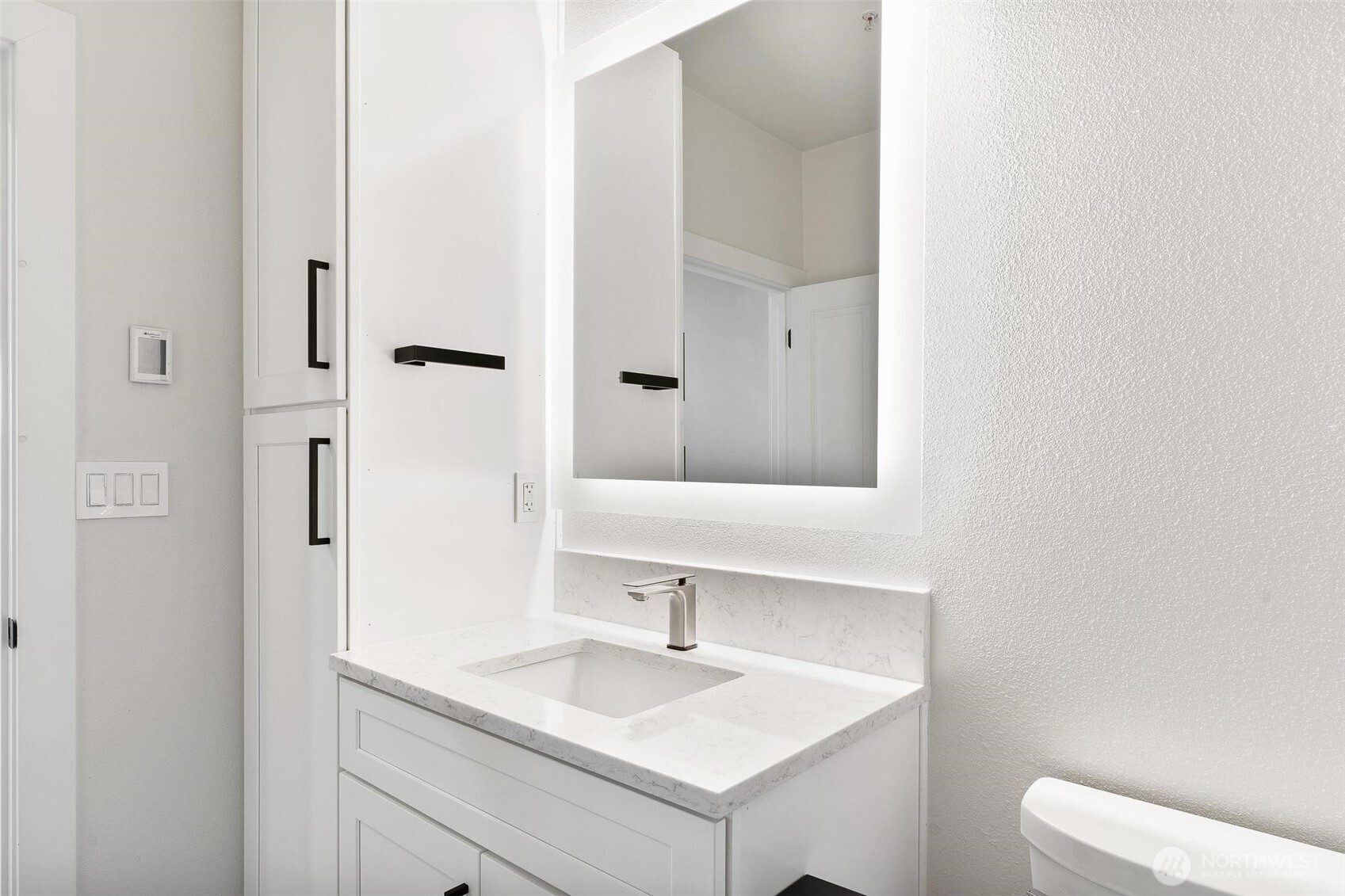 14915 38th Drive Southeast, Unit F3011 Bothell, WA 98012 - Photo 21 of 40 a bathroom with a sink and a mirror
