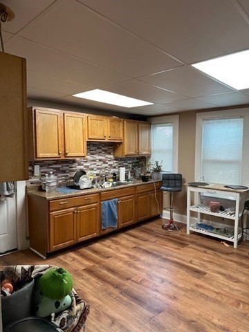 36-38 Greenacre Square, Unit 3 Springfield, MA 01105 - Photo 2 of 15 a kitchen with stainless steel appliances kitchen island granite countertop a stove a sink and a refrigerator