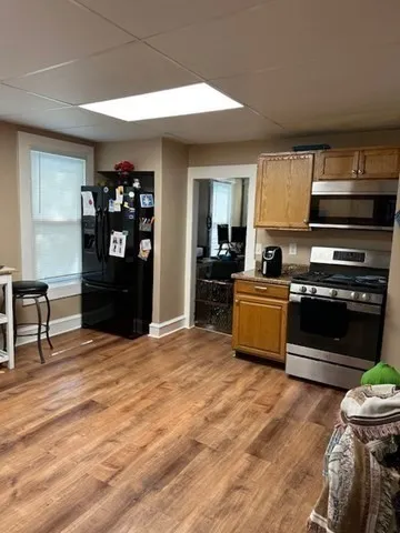 a kitchen with a stove and a refrigerator