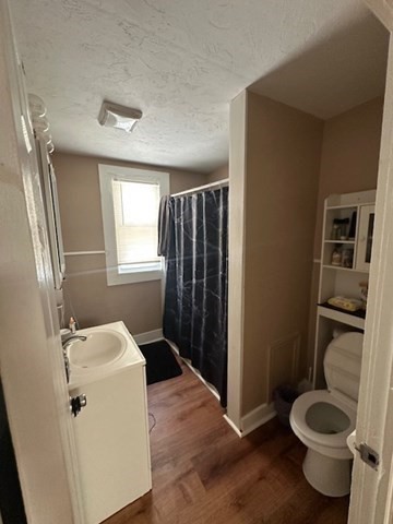 36-38 Greenacre Square, Unit 3 Springfield, MA 01105 - Photo 5 of 15 a bathroom with a sink toilet and shower