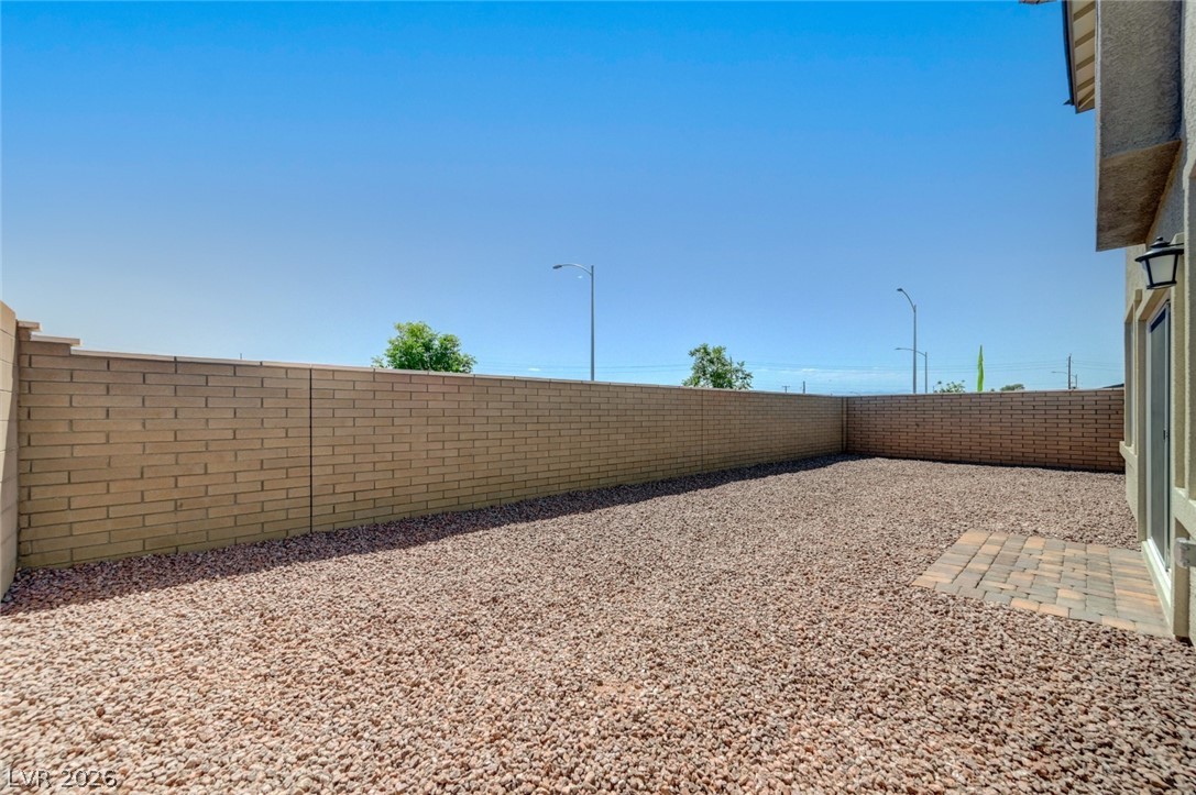 345 Isla Enclave Way Henderson, NV 89011 - Photo 74 of 75 This spacious private yard offers endless possibilities for outdoor living and relaxation.