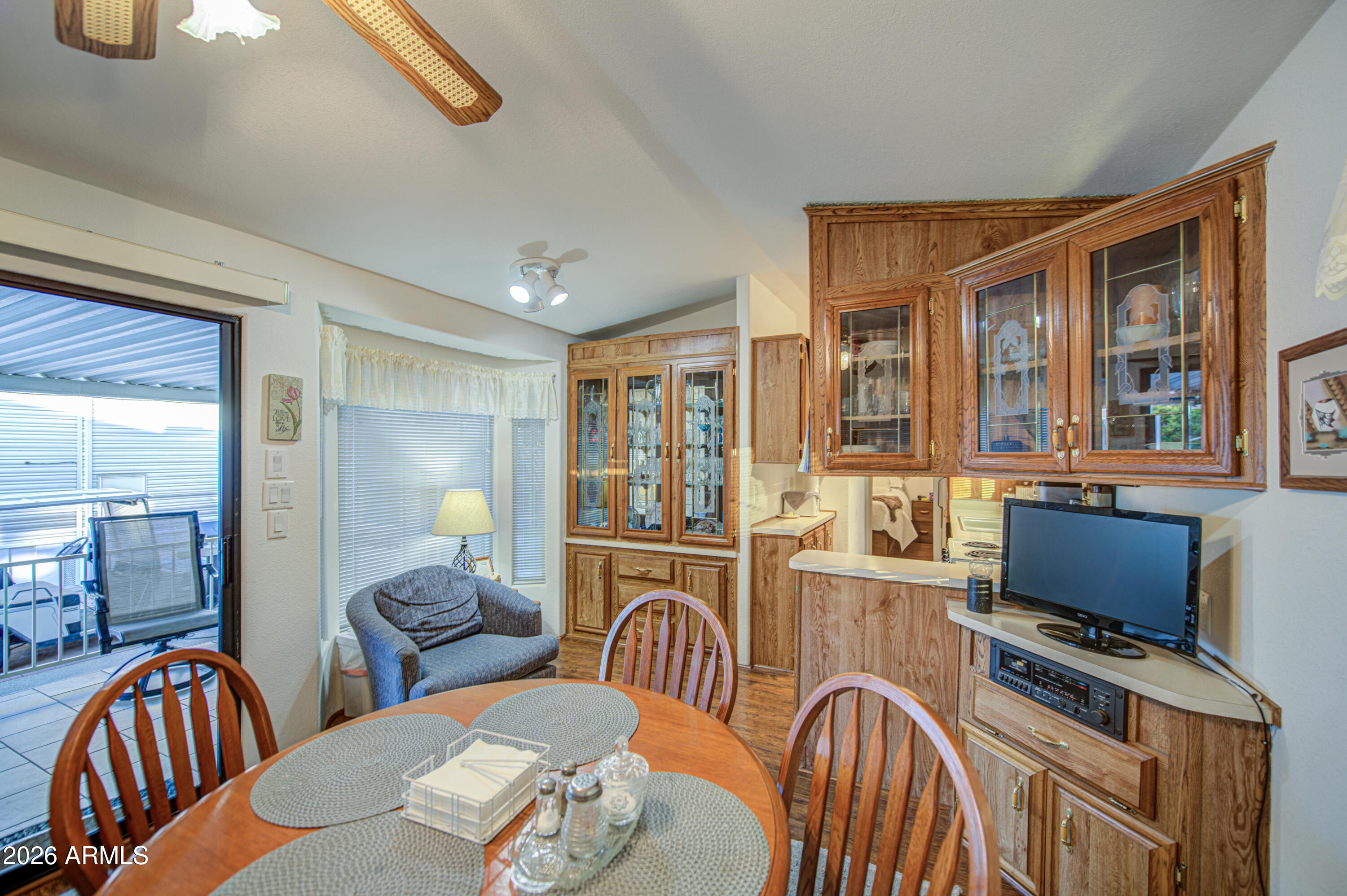 7750 East Broadway Road, Unit 349 Mesa, AZ 85208 - Photo 11 of 39 a bedroom with furniture and a flat screen tv