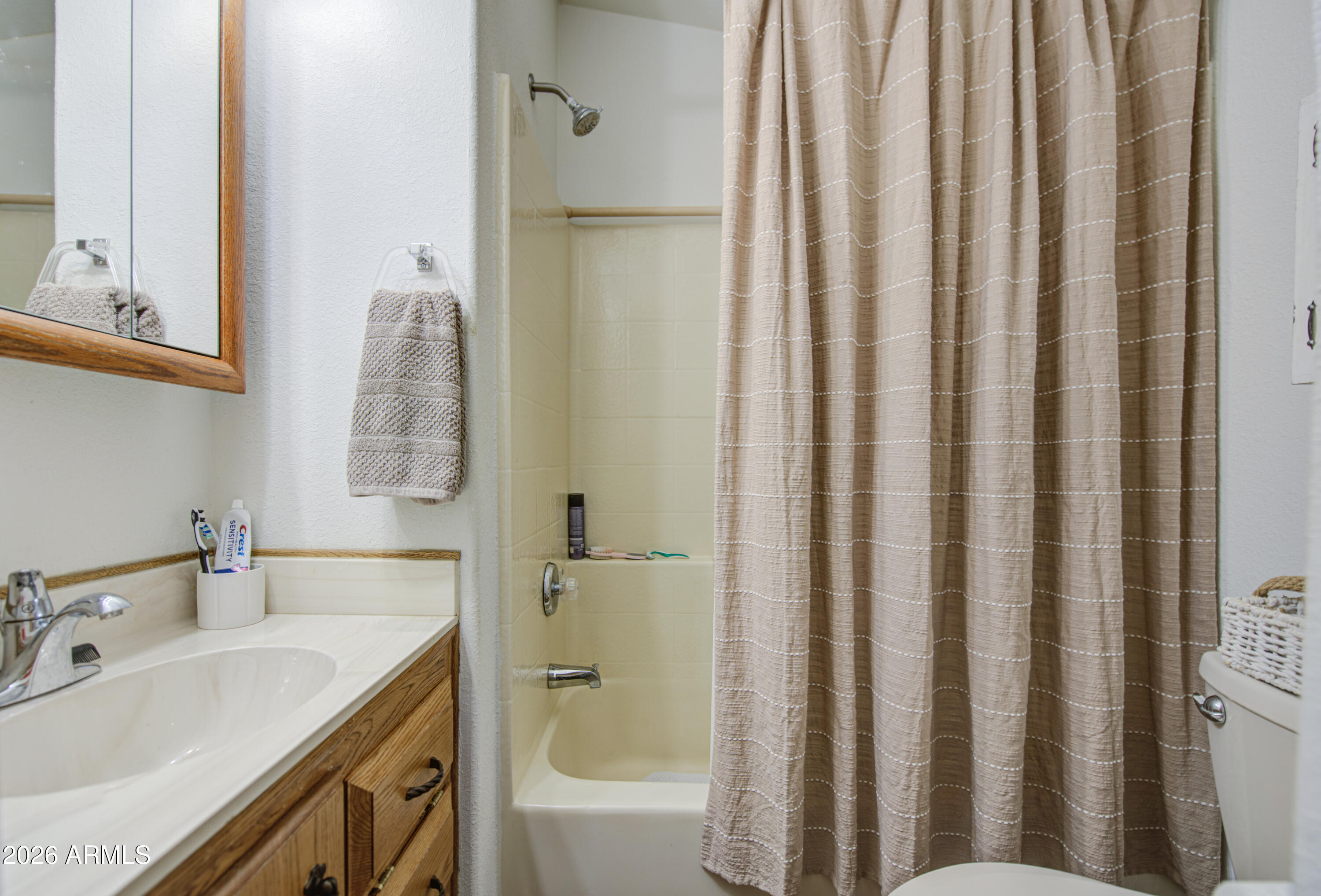 7750 East Broadway Road, Unit 349 Mesa, AZ 85208 - Photo 12 of 39 a bathroom with a sink a toilet and shower
