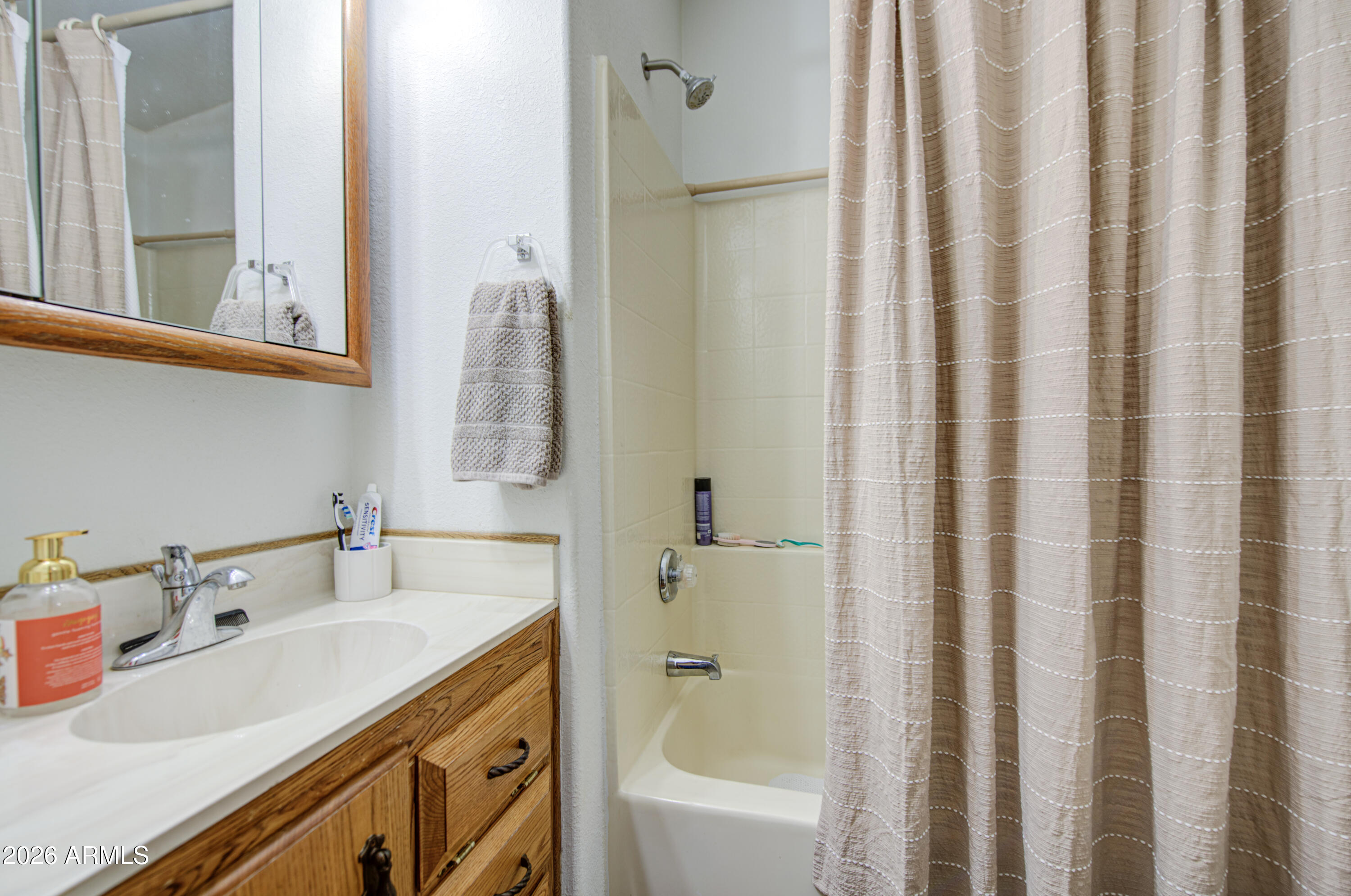 7750 East Broadway Road, Unit 349 Mesa, AZ 85208 - Photo 13 of 39 a bathroom with a sink and a mirror