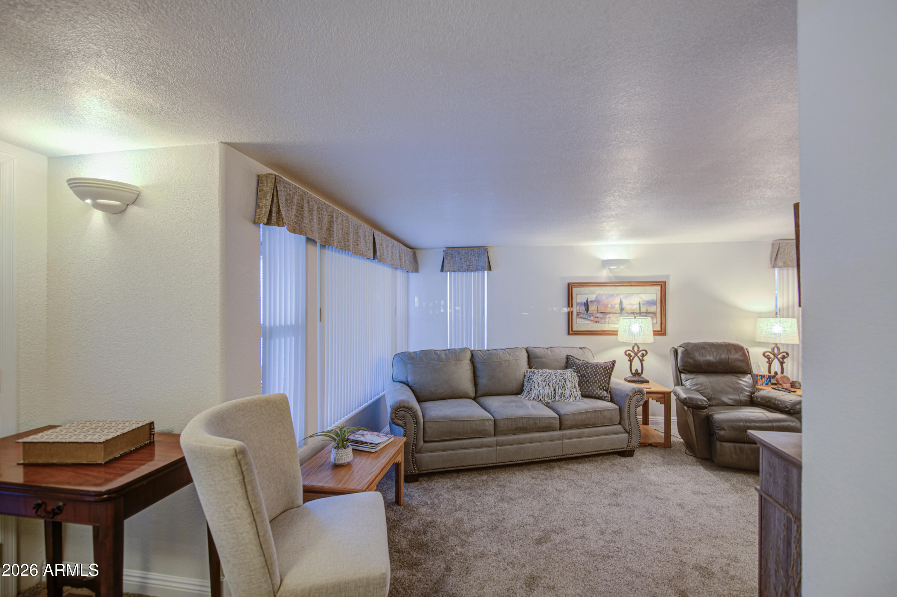 7750 East Broadway Road, Unit 349 Mesa, AZ 85208 - Photo 16 of 39 a living room with furniture and a wooden floor