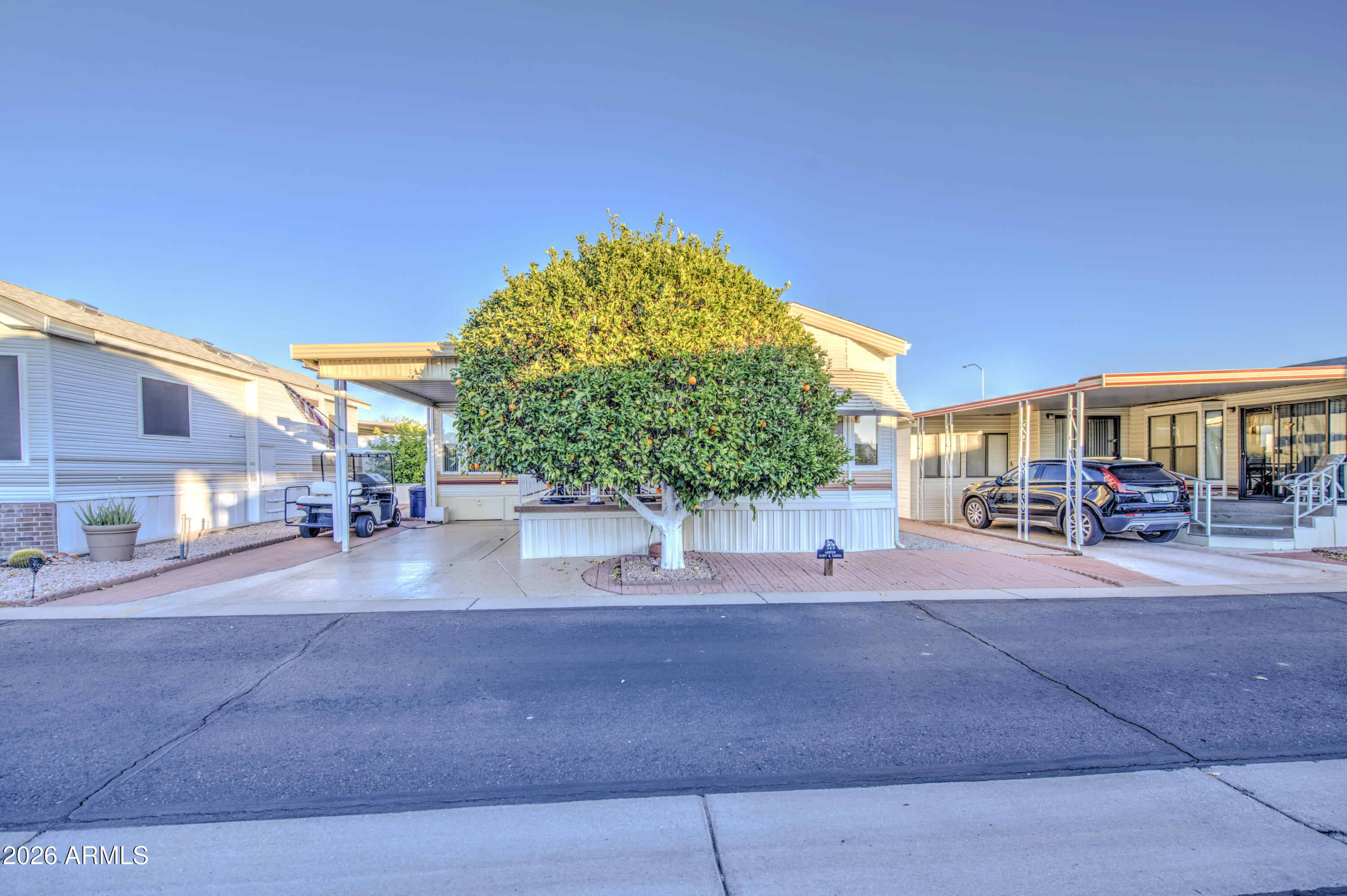 7750 East Broadway Road, Unit 349 Mesa, AZ 85208 - Photo 22 of 39 a view of a street with houses