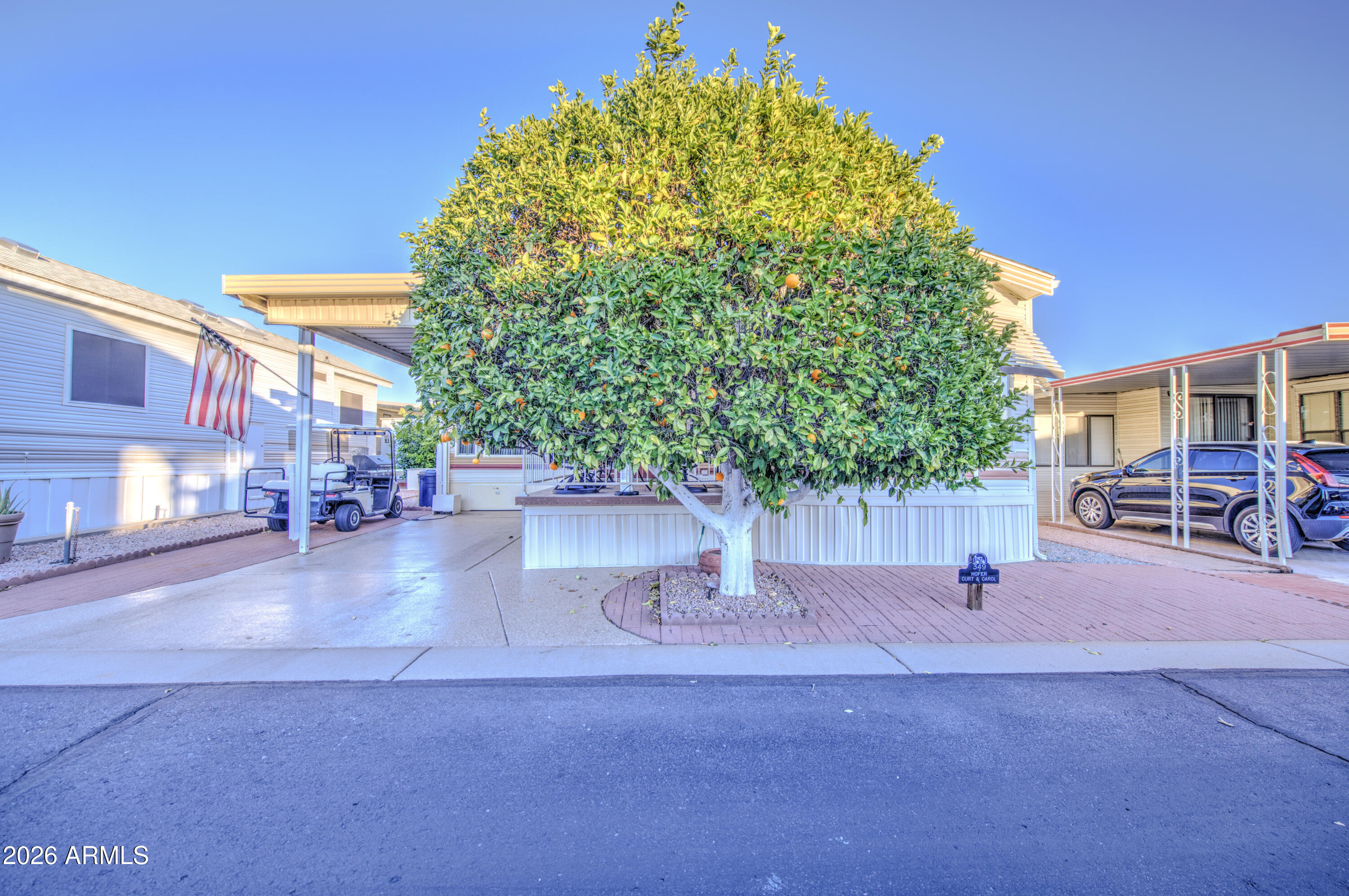 7750 East Broadway Road, Unit 349 Mesa, AZ 85208 - Photo 23 of 39 a view of a street with palm trees