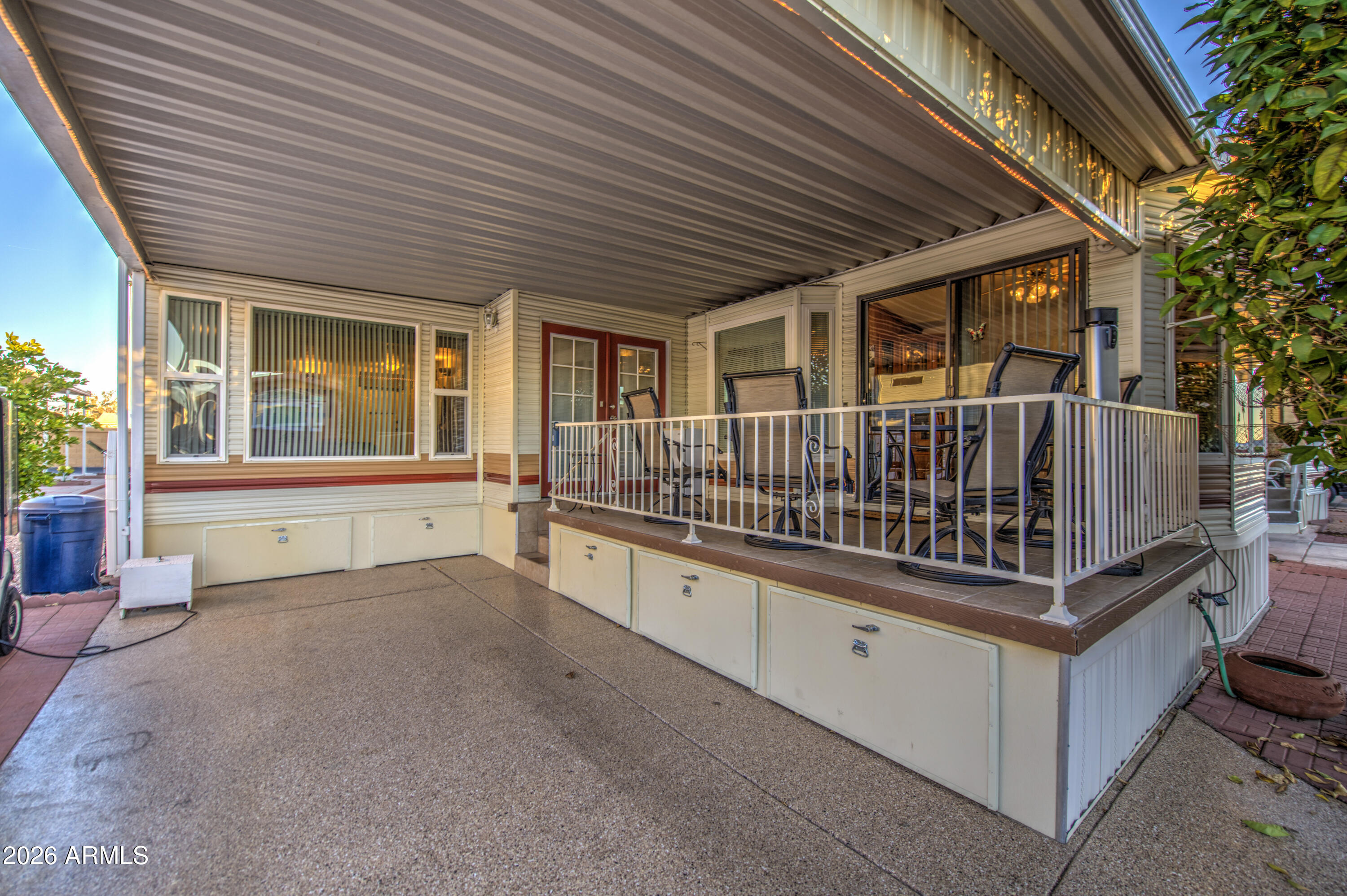 7750 East Broadway Road, Unit 349 Mesa, AZ 85208 - Photo 25 of 39 a view of deck with a large window and wooden fence