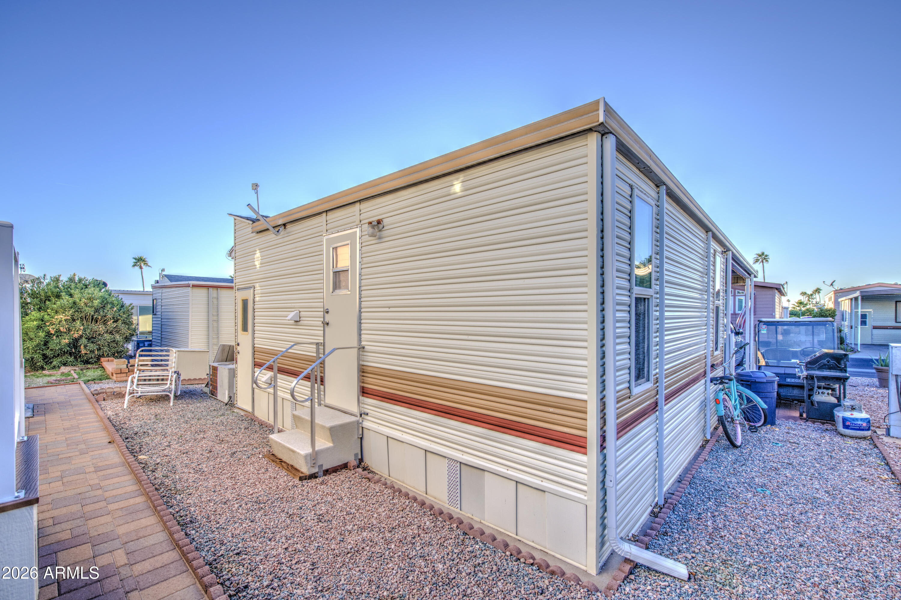 7750 East Broadway Road, Unit 349 Mesa, AZ 85208 - Photo 27 of 39 a view of a house with backyard and sitting area