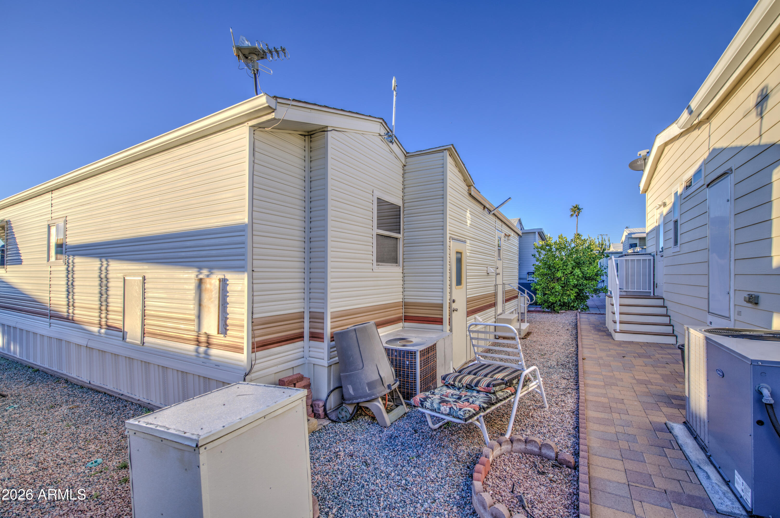 7750 East Broadway Road, Unit 349 Mesa, AZ 85208 - Photo 28 of 39 a backyard of a house with outdoor seating