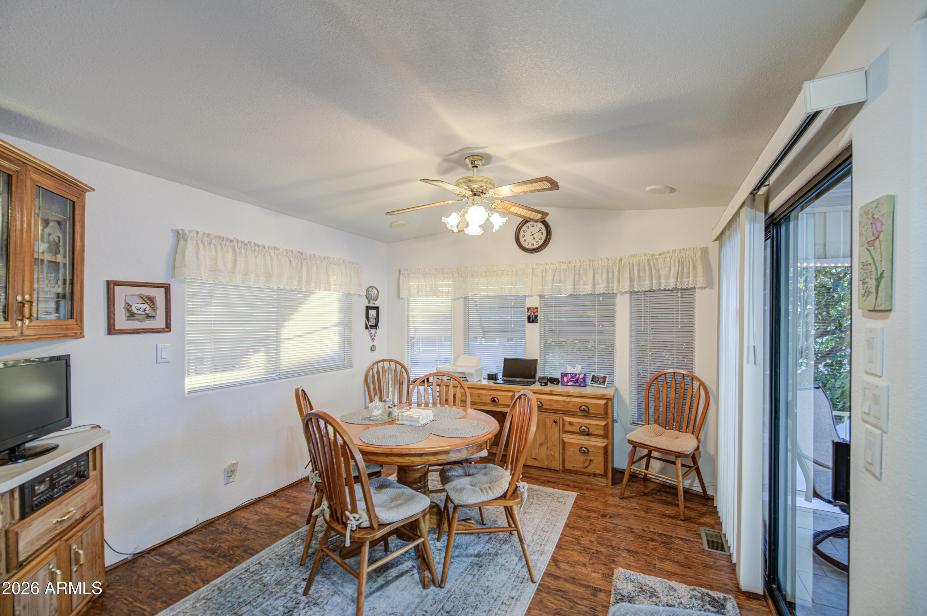 7750 East Broadway Road, Unit 349 Mesa, AZ 85208 - Photo 3 of 39 a dining room with furniture and window