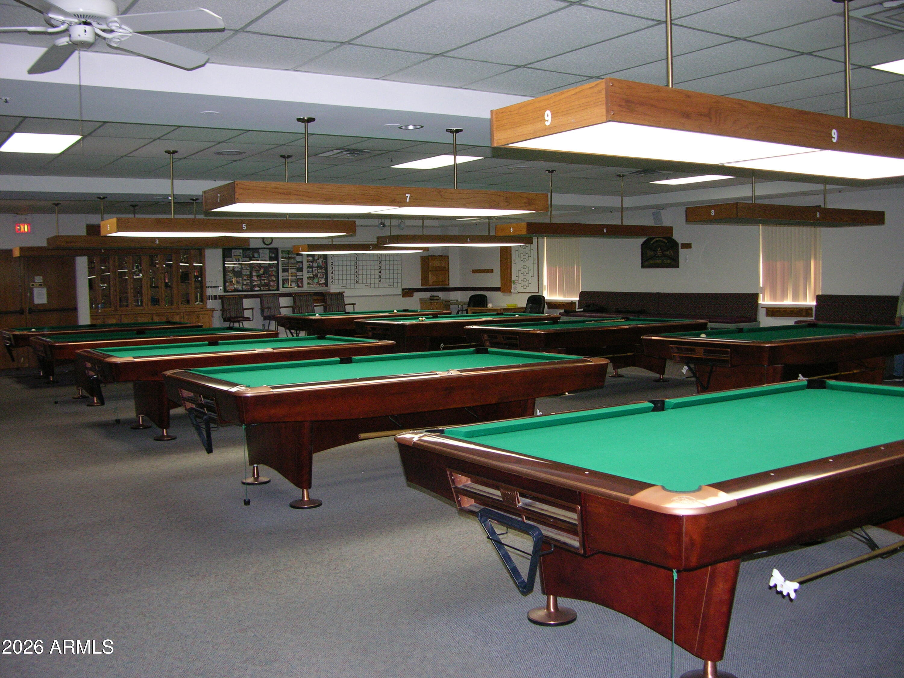 7750 East Broadway Road, Unit 349 Mesa, AZ 85208 - Photo 36 of 39 a room with pool table and chairs