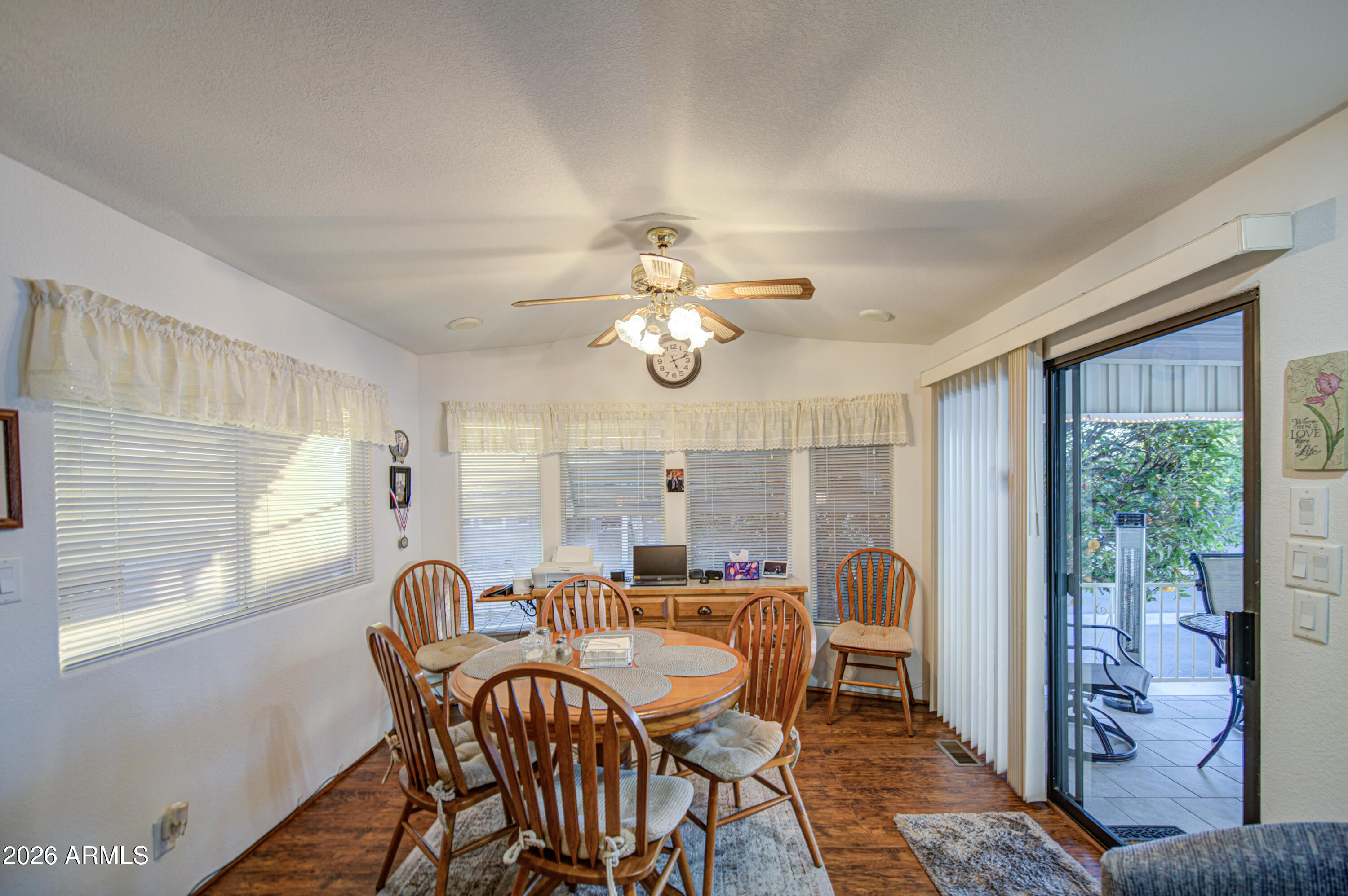 7750 East Broadway Road, Unit 349 Mesa, AZ 85208 - Photo 9 of 39 a dining room with furniture and window