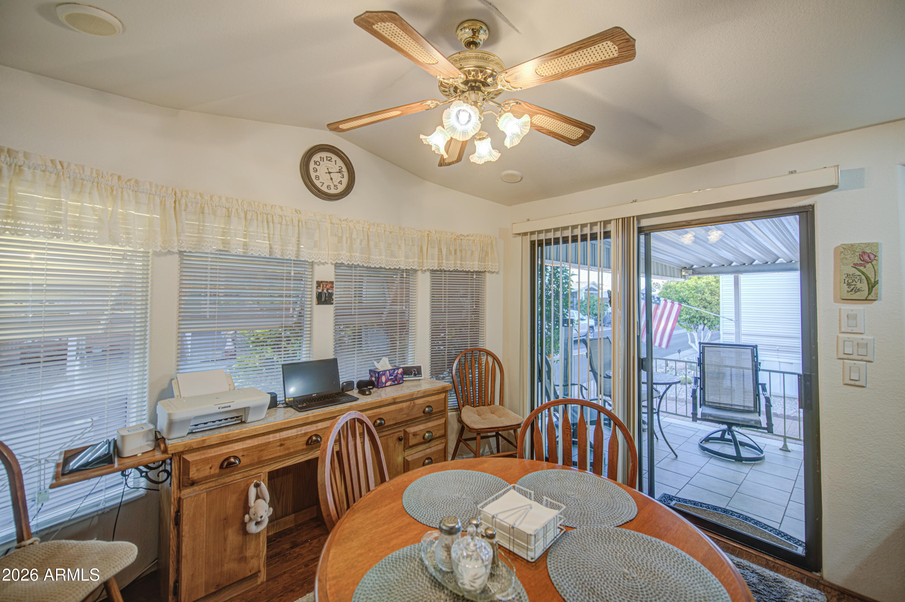 7750 East Broadway Road, Unit 349 Mesa, AZ 85208 - Photo 10 of 39 a very nice looking dining room with furniture a chandelier and a rug