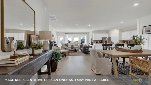 a living room with lots of furniture and a table
