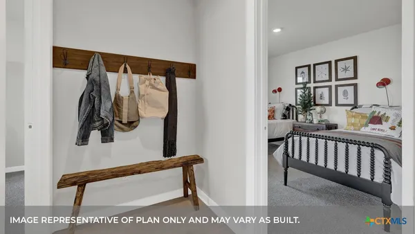 a view of a hallway with a small white walls