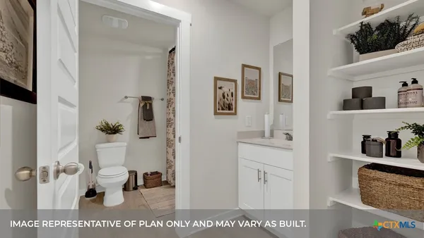 a bathroom with a tub sink and toilet