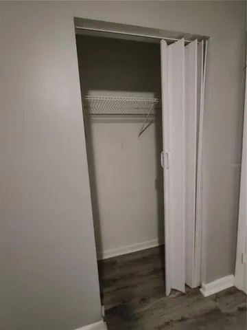 a utility room with a wooden door