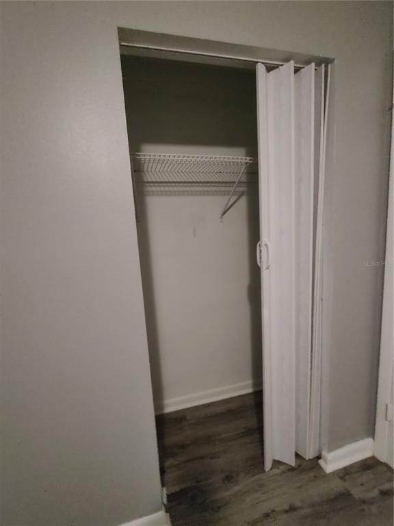 200 Church Street, Unit F2 Leesburg, FL 34748 - Photo 12 of 23 a utility room with a wooden door