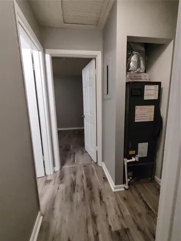 a view of a hallway and wooden floor