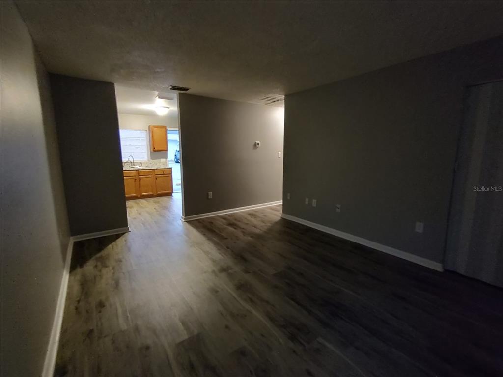200 Church Street, Unit F2 Leesburg, FL 34748 - Photo 5 of 23 wooden floor in an empty room