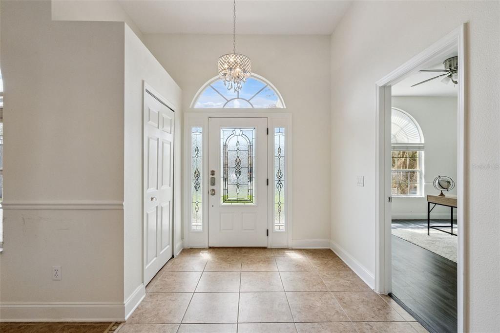 2541 Teton Stone Run Orlando, FL 32828 - Photo 20 of 82 a view of a windows and a chandelier in a room