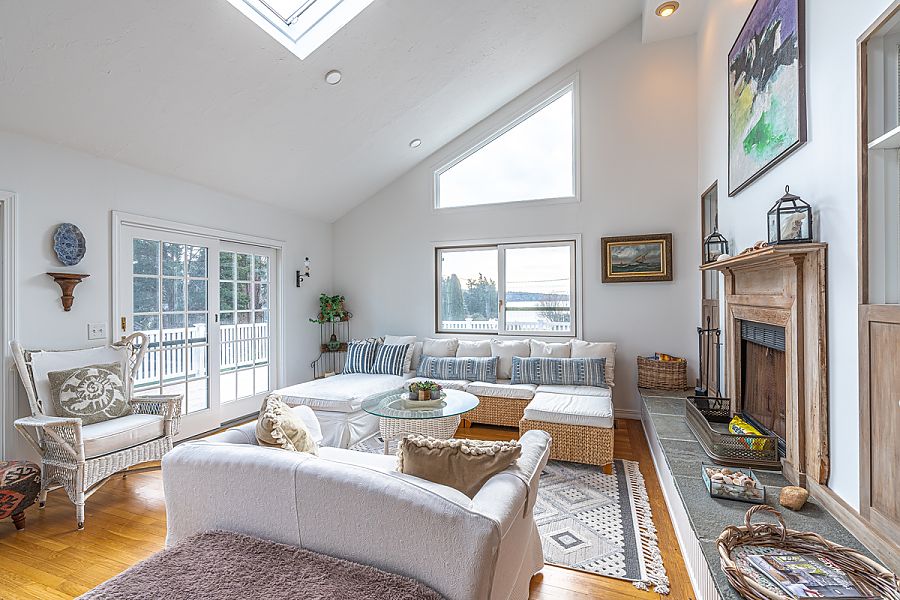 95 Hines Point Road Vineyard Haven, MA 02568 - Photo 13 of 43 a living room with furniture fireplace and a large window