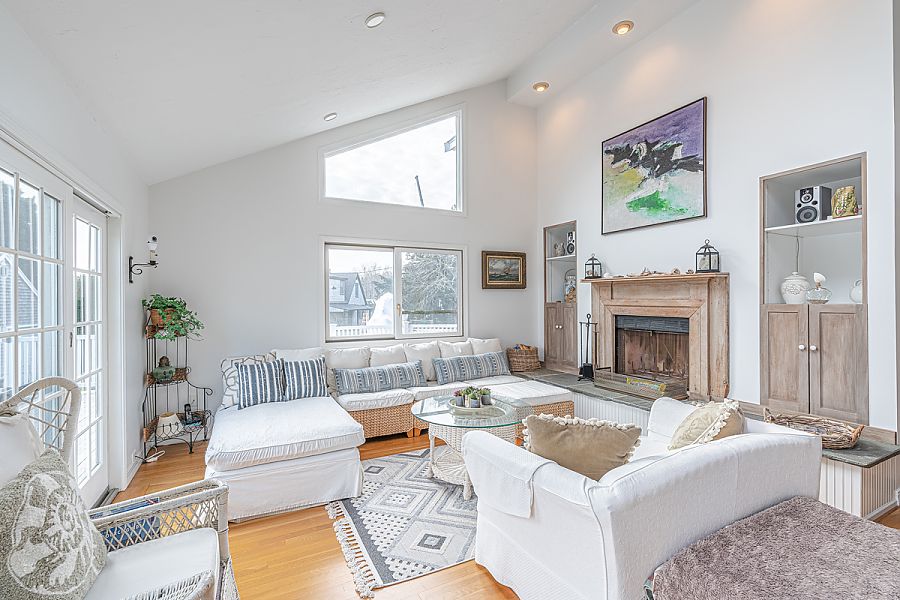 95 Hines Point Road Vineyard Haven, MA 02568 - Photo 14 of 43 a living room with furniture a fireplace and a window