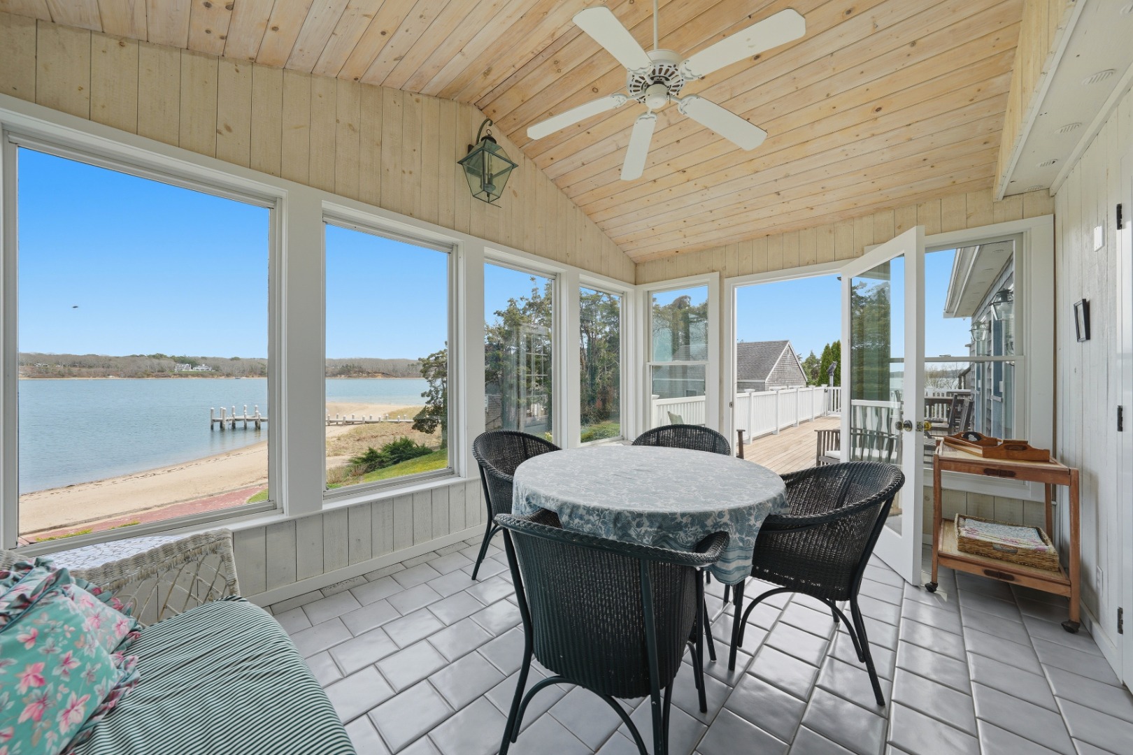 95 Hines Point Road Vineyard Haven, MA 02568 - Photo 18 of 36 a dining room with furniture a chandelier and a rug