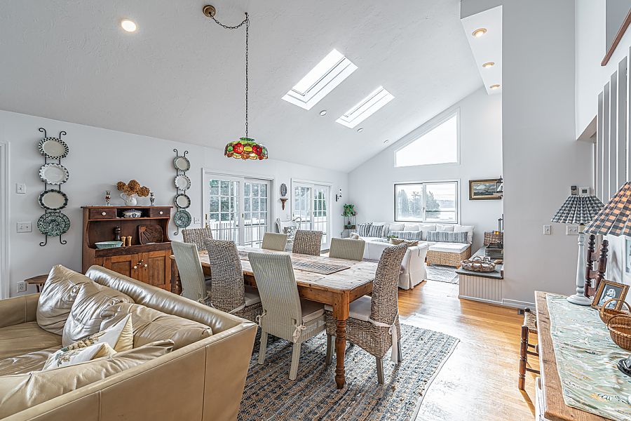 95 Hines Point Road Vineyard Haven, MA 02568 - Photo 18 of 43 a view of a dining room with furniture window and wooden floor