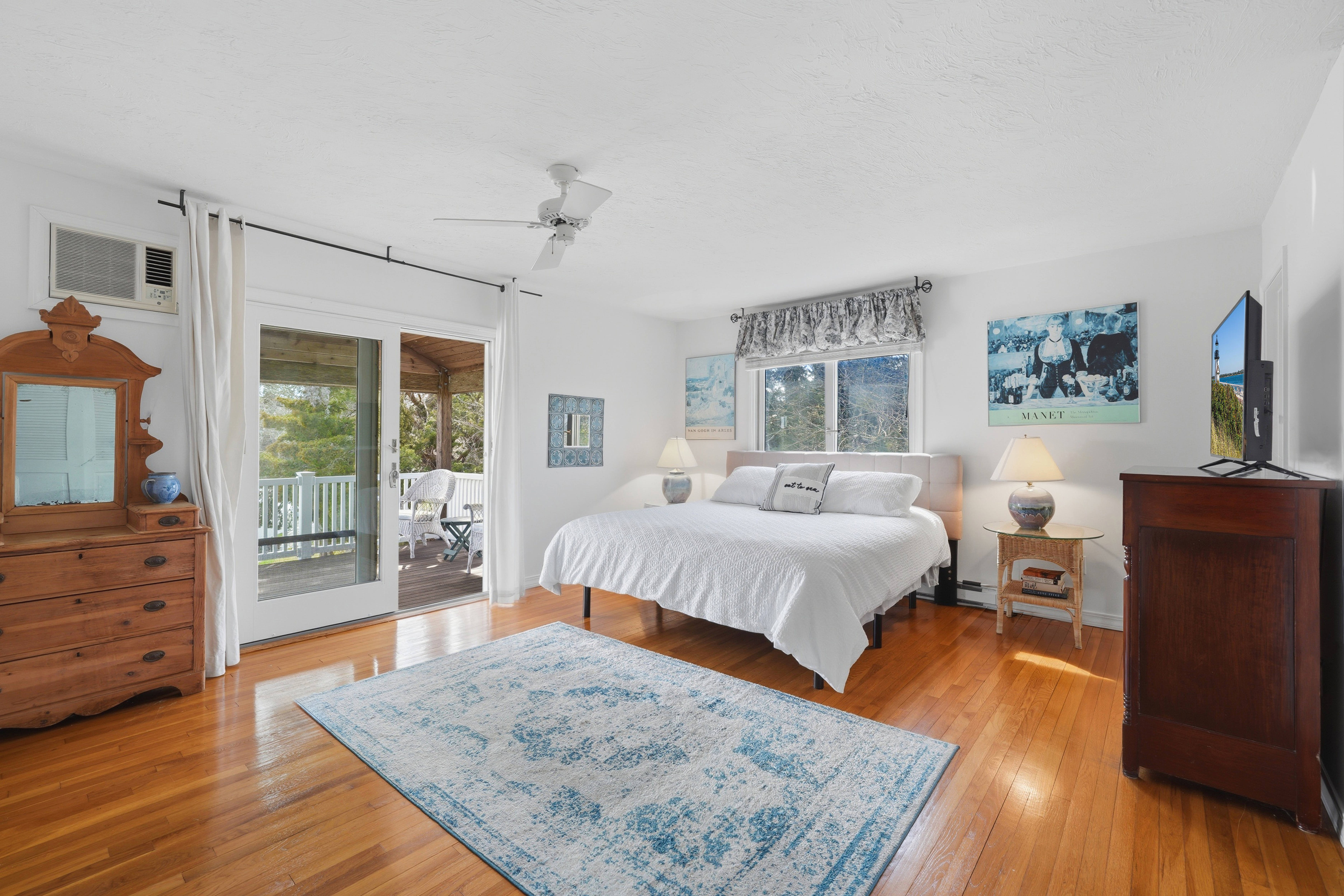 95 Hines Point Road Vineyard Haven, MA 02568 - Photo 19 of 36 a bedroom with a bed and wooden floor