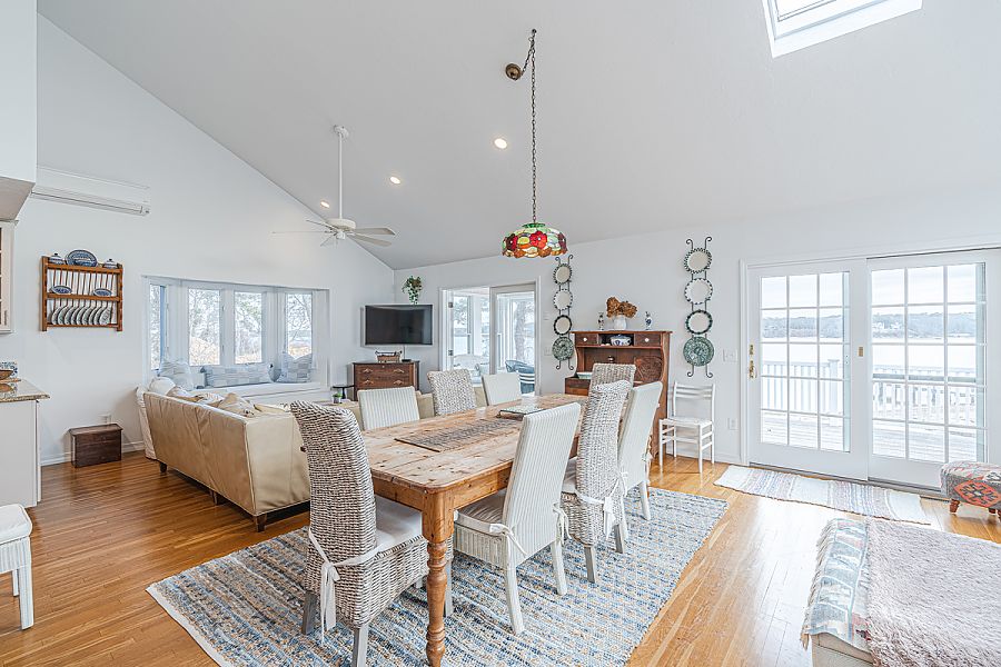 95 Hines Point Road Vineyard Haven, MA 02568 - Photo 20 of 43 a view of a dining room with furniture wooden floor and chandelier
