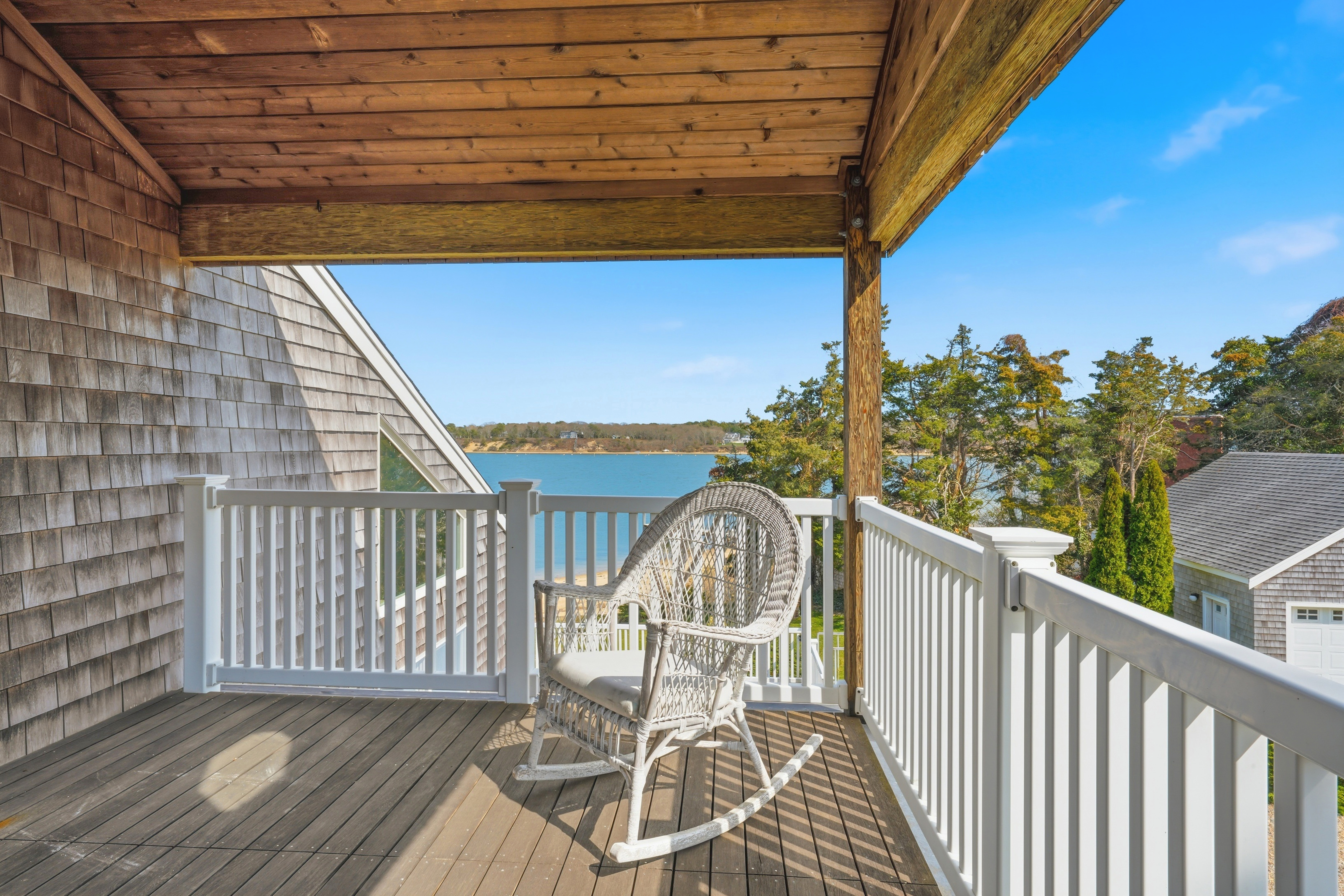 95 Hines Point Road Vineyard Haven, MA 02568 - Photo 21 of 36 a view of a wooden deck with a patio