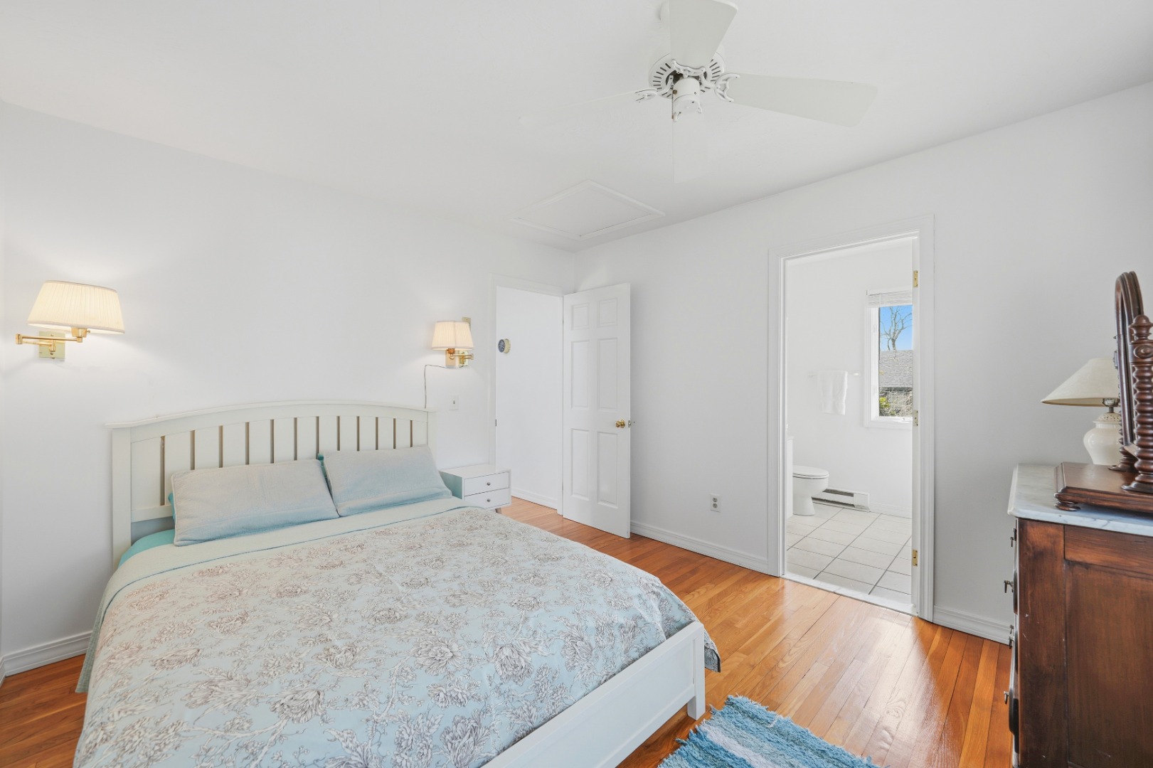 95 Hines Point Road Vineyard Haven, MA 02568 - Photo 22 of 36 a bedroom with a bed and wooden floor