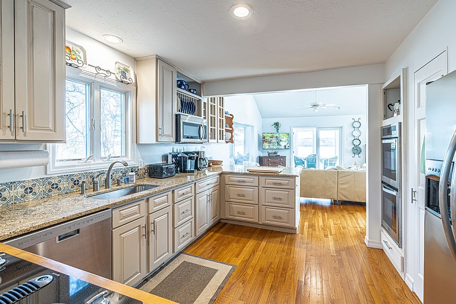 95 Hines Point Road Vineyard Haven, MA 02568 - Photo 23 of 43 a kitchen with sink cabinets and refrigerator