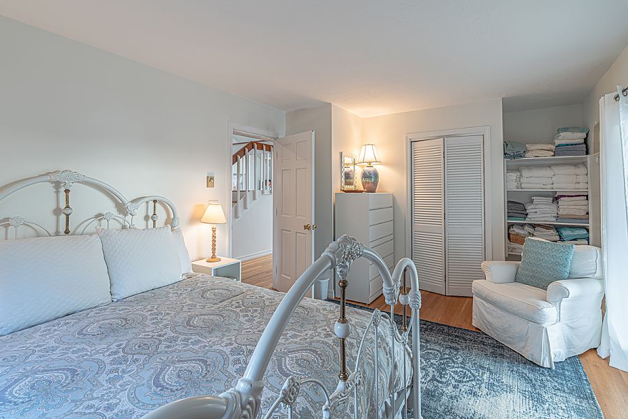 95 Hines Point Road Vineyard Haven, MA 02568 - Photo 26 of 43 a bedroom with a bed and a couch