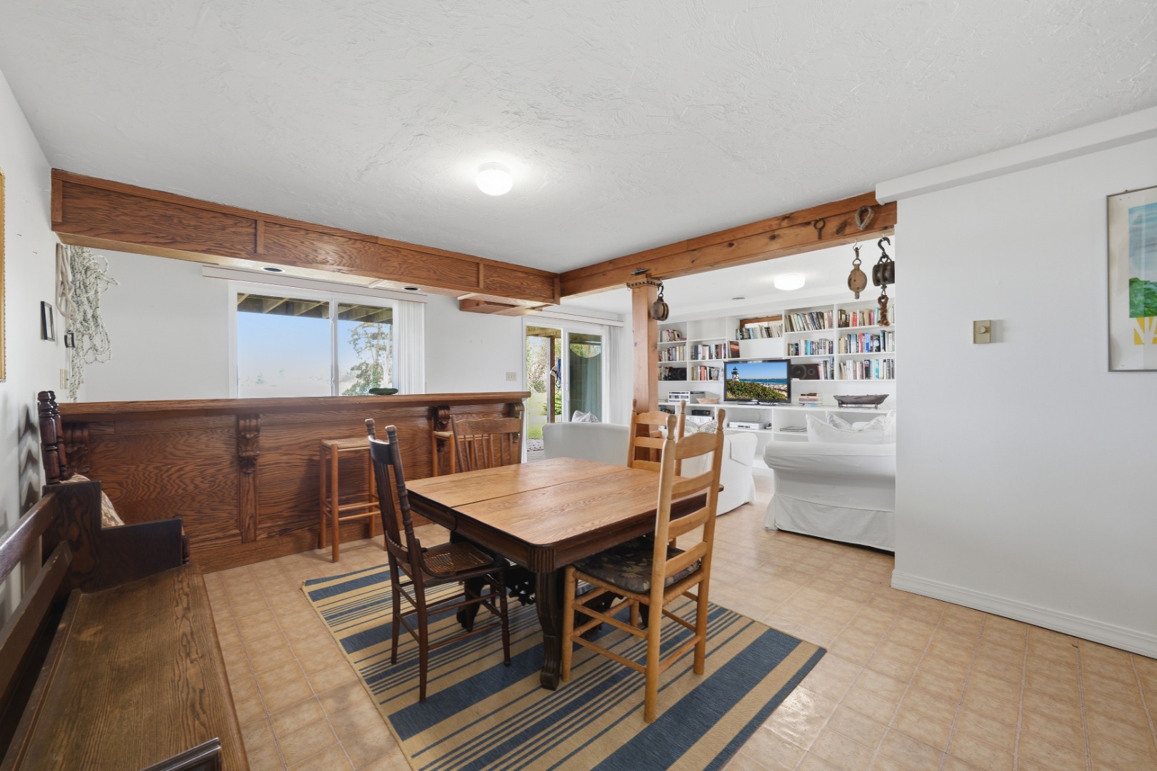 95 Hines Point Road Vineyard Haven, MA 02568 - Photo 26 of 36 a dining room with furniture and wooden floor