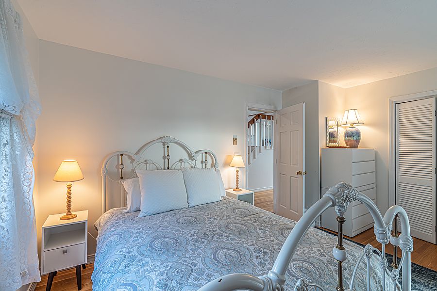 95 Hines Point Road Vineyard Haven, MA 02568 - Photo 27 of 43 a bedroom with a bed and a dresser with mirror