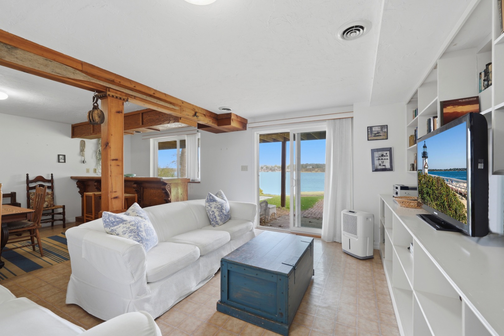 95 Hines Point Road Vineyard Haven, MA 02568 - Photo 27 of 36 a living room with furniture and a flat screen tv