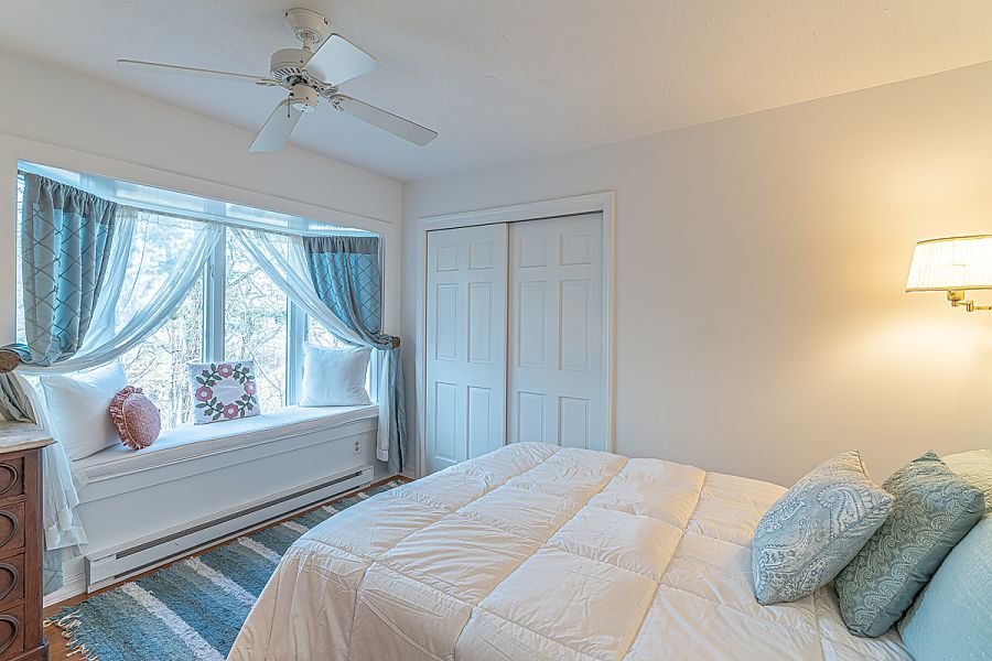 95 Hines Point Road Vineyard Haven, MA 02568 - Photo 29 of 43 a bedroom with a bed and a window