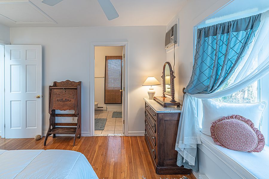 95 Hines Point Road Vineyard Haven, MA 02568 - Photo 30 of 43 a living room with furniture a fireplace and wooden floor