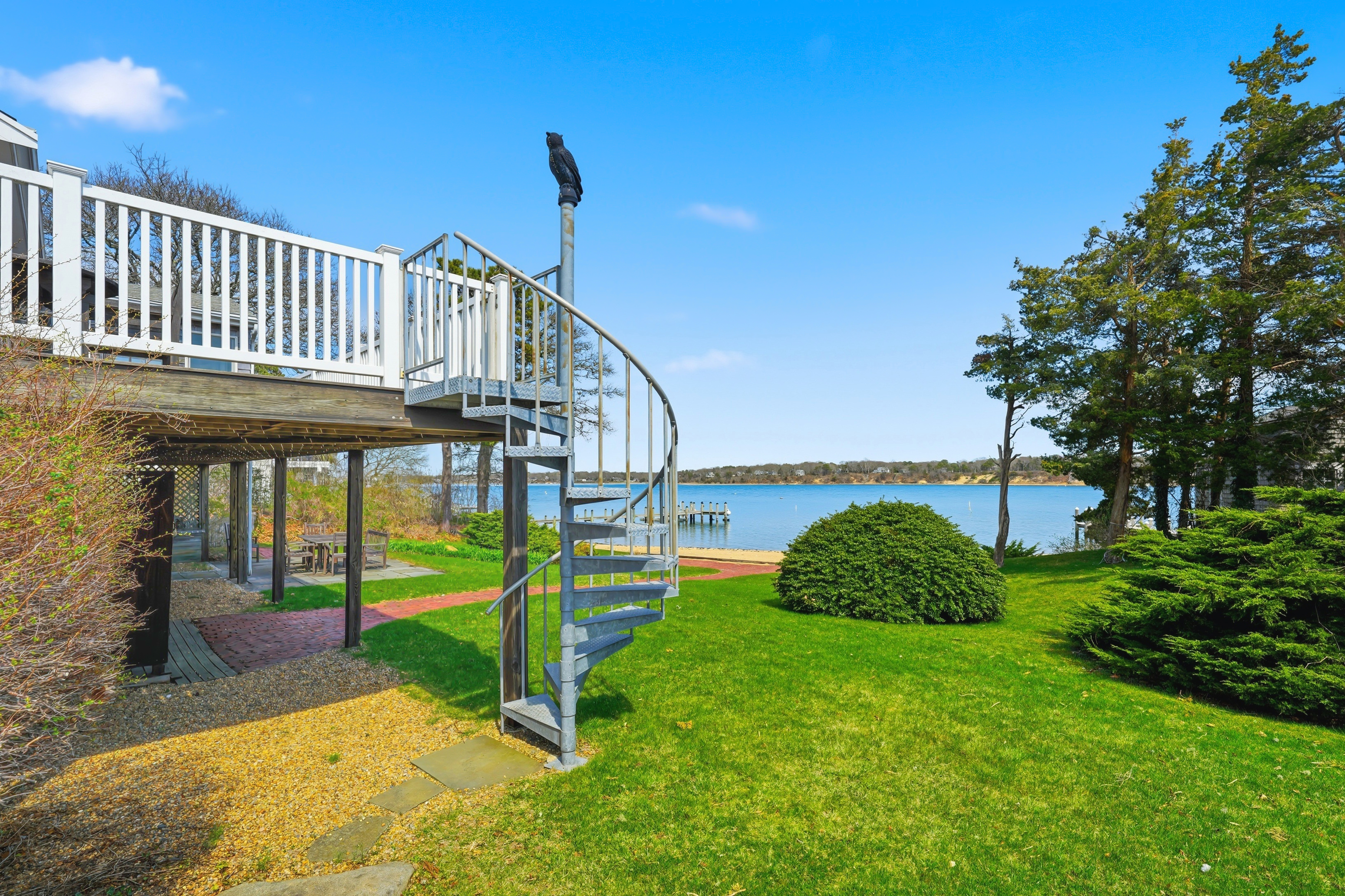 95 Hines Point Road Vineyard Haven, MA 02568 - Photo 30 of 36 a view of a house with a yard