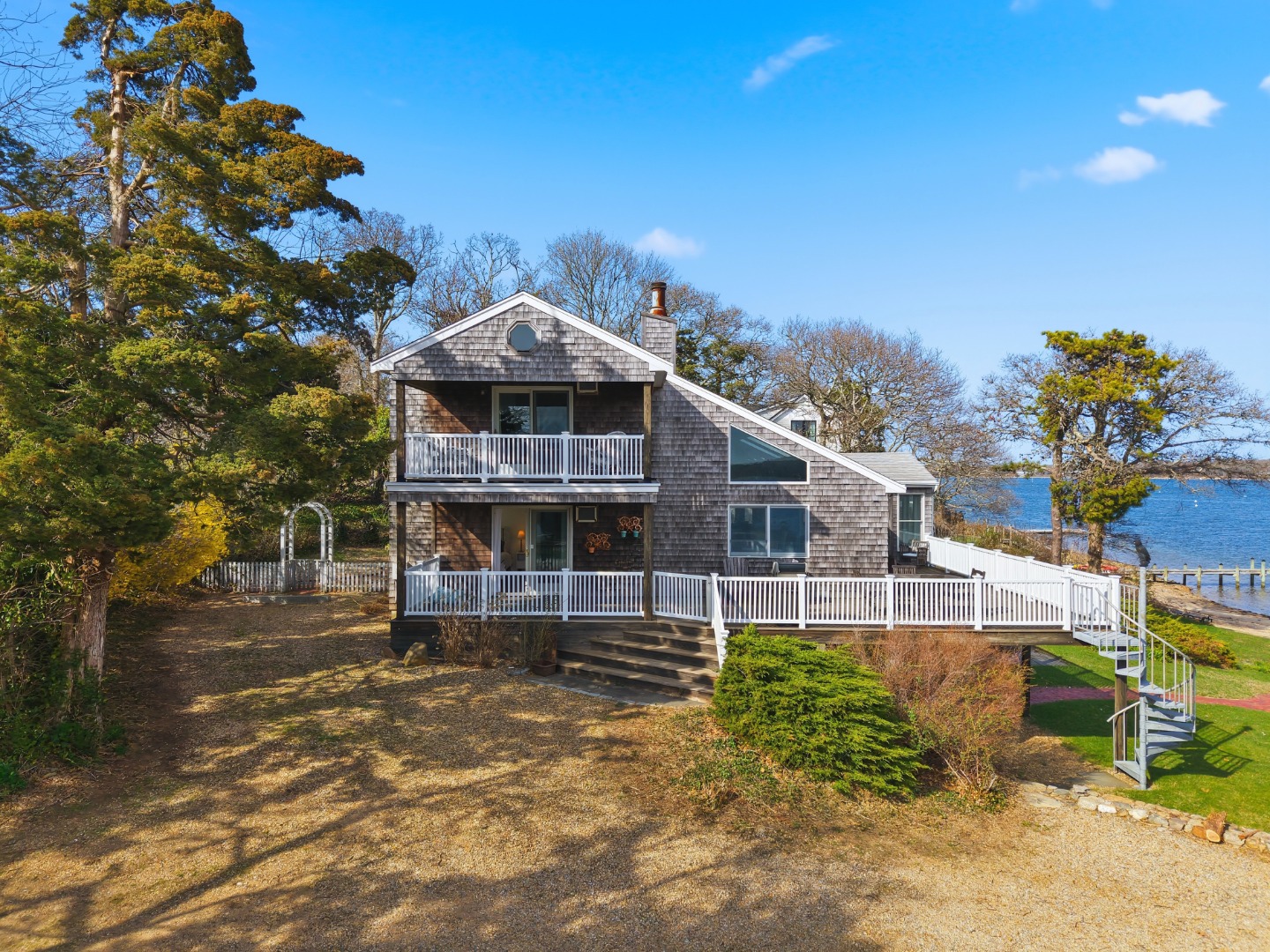 95 Hines Point Road Vineyard Haven, MA 02568 - Photo 3 of 36 a front view of a house with a yard