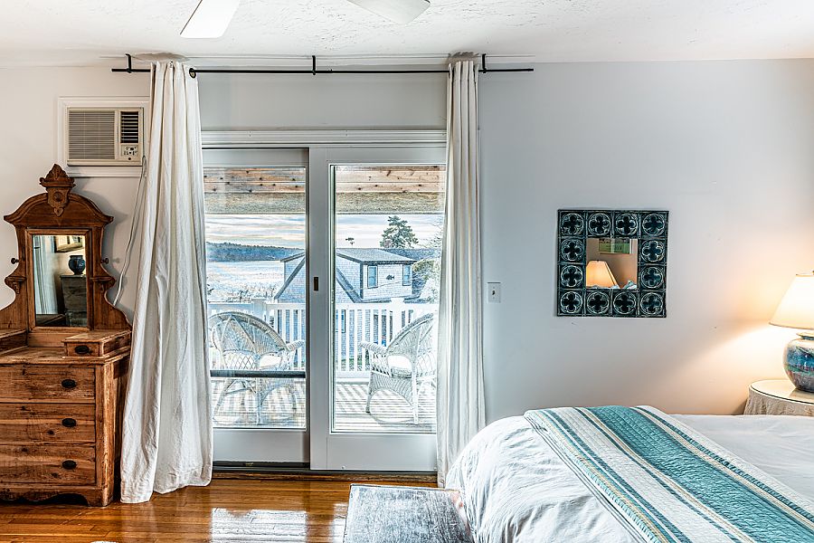 95 Hines Point Road Vineyard Haven, MA 02568 - Photo 32 of 43 a bedroom with a bed and a window